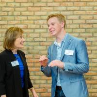 Donna Brooks talking with a student at Scholarship Dinner 2019